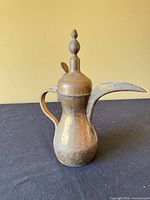 Side view of brass Dallah coffee pot