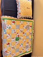 Quilt laid out with matching pillow