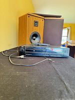 Front view of JVC CD player with speaker behind