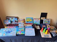 Wide shot showing entire assortment of games and electronic bowling set on table