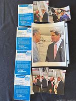 Overview of autographed 8x10 photo, five candid photos, and four Ohio Votes pamphlets