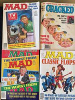 Four magazine covers: MAD Super Special Fall 1984, CRACKED, The Worst from MAD, MAD Classic Flops