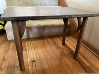 Table front and side showing legs and stretcher