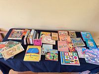 Overall view of approximately 25 children’s books laid out on table