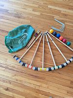 Full set laid out showing mallets, balls, wickets and bag