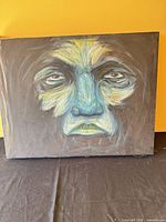 Front view of abstract portrait painting on canvas