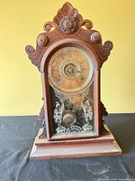 Full view of carved wooden mantel clock