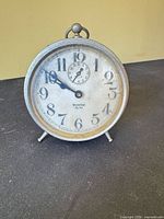 Front view of Westclox Big Ben alarm clock showing dial, numerals, sub-seconds dial and hands