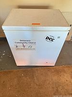 front view of white chest freezer with stickers