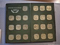 open display case showing 24 medals