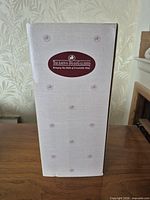 Tall white Ashton-Drake Galleries branded doll box