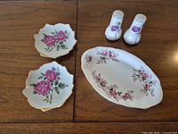 Top view of platter, two scalloped dishes, salt & pepper shakers