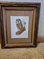 Full view of framed owl print with rustic wood frame and mat