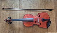 Top view of full-size violin with bow