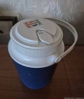 Top view of jug showing white lid with Pepsi logo and spout