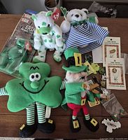 Group shot of all plush toys, pins and backing cards