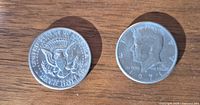Both coins showing obverse and reverse sides