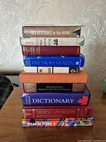 Stack of books showing spines for title identification