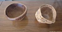 Top view of both burl wood bowls showing shapes and interiors