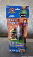 Front of sealed Marvin the Martian PEZ Candy Hander dispenser in packaging