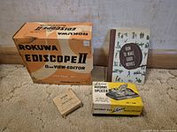 Group shot showing Rokuwa editor box, Kodak manual, splicer box, tape packet