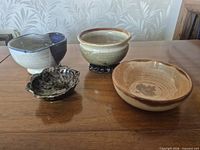All four stoneware bowls grouped on table