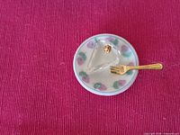 all three miniature items arranged on pink background