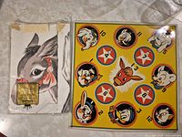 Peg game board and donkey game sheet side by side