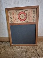 Front view showing chalkboard, wooden frame and full paper insert with clock and alphabet