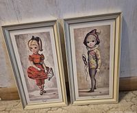 Both framed prints side by side showing overall condition and design