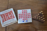 Hi-Q box, plastic peg board, wooden IQ Tester displayed