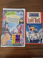 Front view of both VHS tapes showing titles and cover art