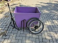 Overall lot showing plywood box, wheels, tow arm, U-brackets