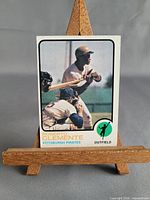 Full front view of Roberto Clemente 1973 Topps card on easel
