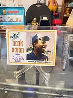 Front view of 1974 Topps Hank Aaron baseball card in plastic holder