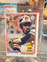 Front view of Eddie Murray 1978 Topps card showing image, team name, trophy icon, and player name
