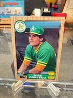 Front view of 1987 Topps Jose Canseco rookie card in display stand