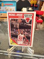 Front of Michael Jordan Fleer #21 card on stand