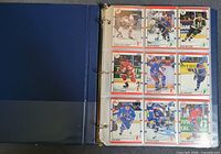 Open binder showing nine Score hockey cards front side