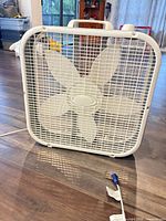 Front view of white 20-inch box fan showing blades and grill