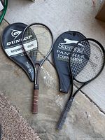 Both rackets with their respective covers