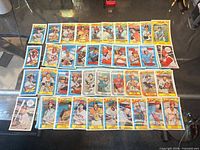 Overall view of approximately 45 Kellogg's 3-D Super Stars baseball cards laid out on table