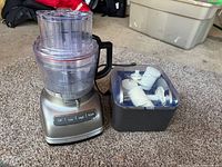 Food processor assembled with storage case of accessories