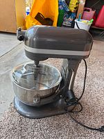 Full view of gray KitchenAid Professional 600 mixer with bowl and pour shield attached