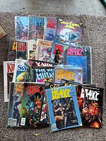 Full lot spread showing Heavy Metal magazines, Marvel Graphic Novels including The New Mutants, Raven, A Distant Soil and others