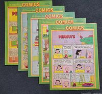 Front view of five inserts showing Peanuts cover pages