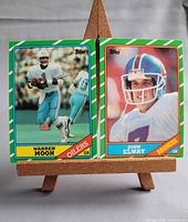 Front view of both 1986 Topps cards on easel
