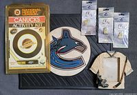 All six items group view: activity kit, floor mat, three pin packages, jersey frame