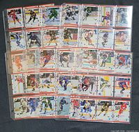 binder sheet rows of 1990 Score hockey cards