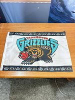 Full view of Vancouver Grizzlies flag laid flat